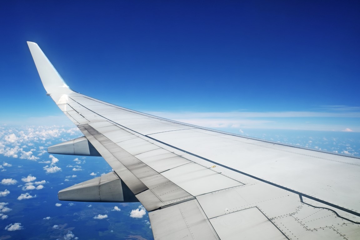 airliner wing in flight on blue sky background 2021 08 26 15 35 20 utc